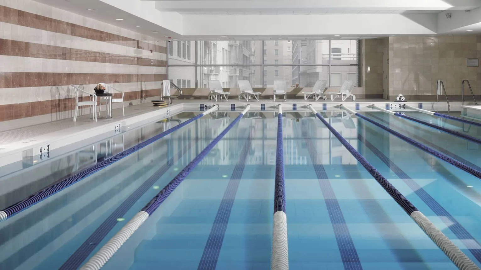 Lane-divided saline lap pool at the connected Equinox Sports Club.