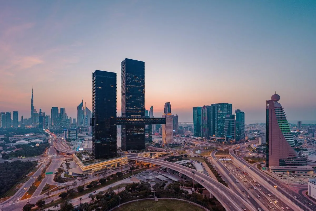 One Za'abeel towers and Dubai skyline at dusk