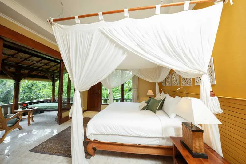 Guest room opening to a private terrace at Oneworld Ayurveda Ubud