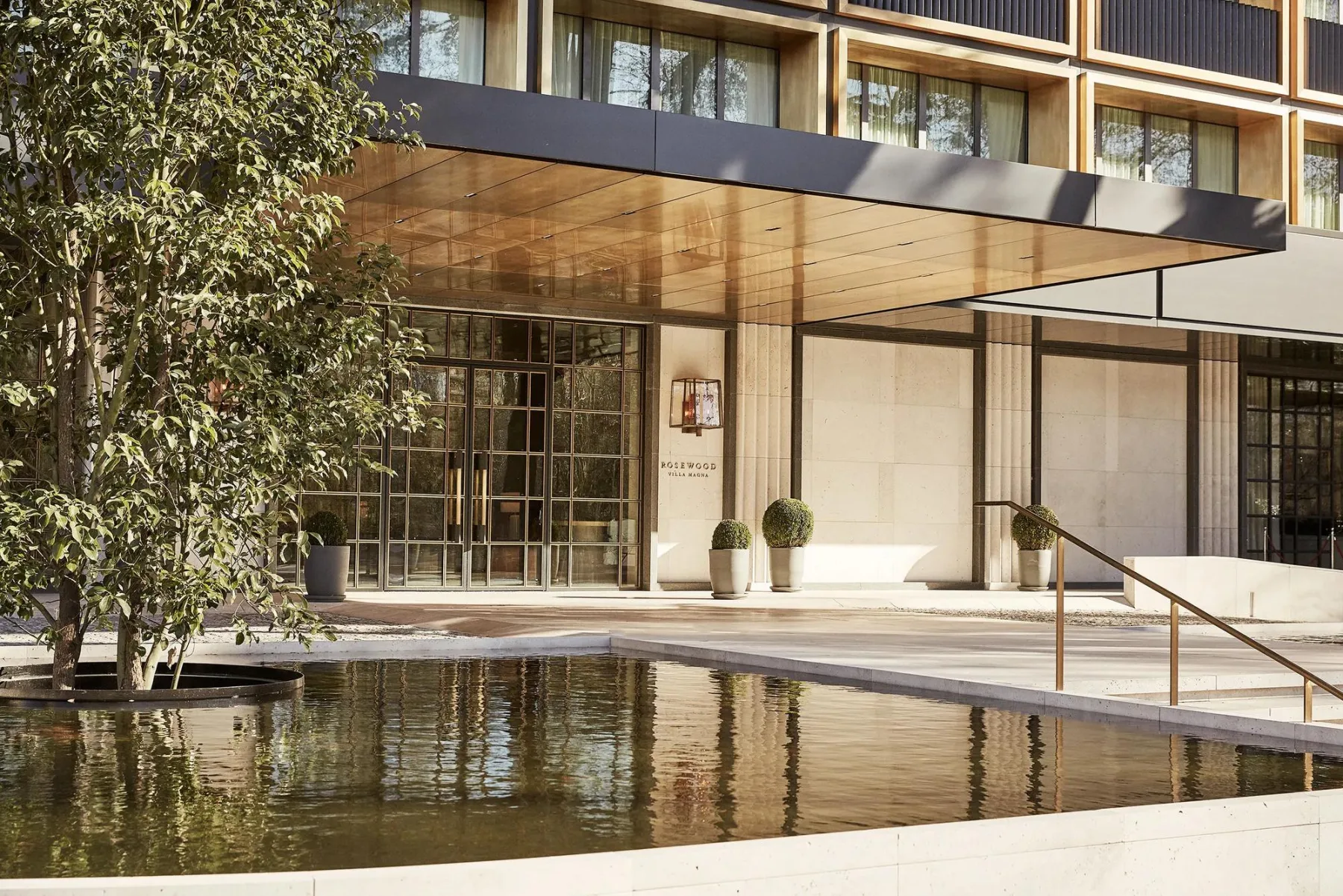 Rosewood Villa Magna hotel entrance and reflecting pool in Madrid.