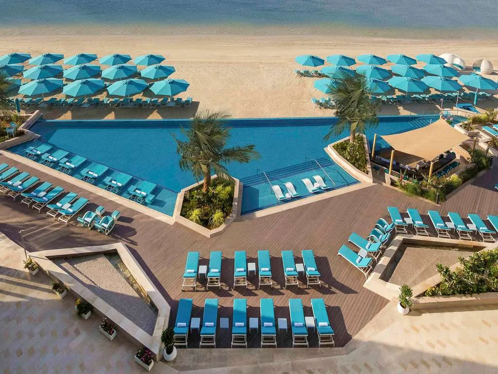 Pool and beachfront at The Retreat Palm Dubai